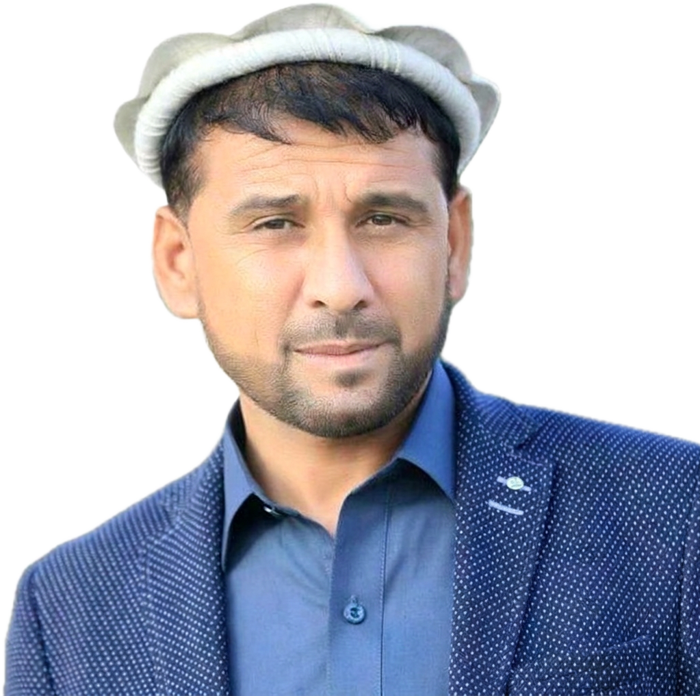 Engr. Azizullah Niazi, President of MECC, on site in high-visibility clothing on the Chawk Dand to Bagh Pol road in Kandahar province, with plant working behind him
